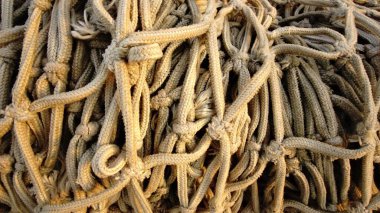 Stacked rustic fishing net as a background