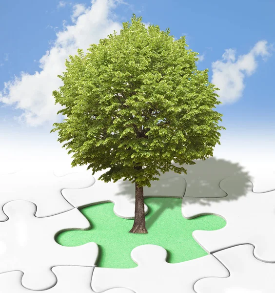 Lone tree concept in a jigsaw puzzle backgound - management and strategy about planting of new trees to mitigate excess CO2 in the atmosphere