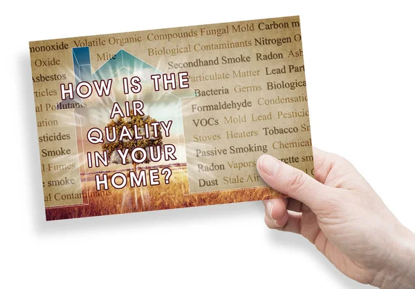 HOW IS THE AIR QUALITY IN YOUR HOME? - concept with the most common dangerous domestic pollutants in our homes and hand holding a postcard