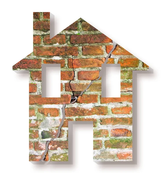 レンガの壁の背景に家のアイコンと割れた家のコンセプトイメージ — ストック写真