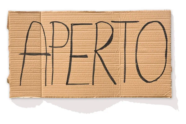 Open sign in italian language against a cardboard - aperto means open