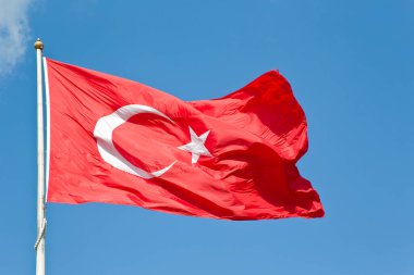 Turkish flag - Moon and star icon on red background against blue sky