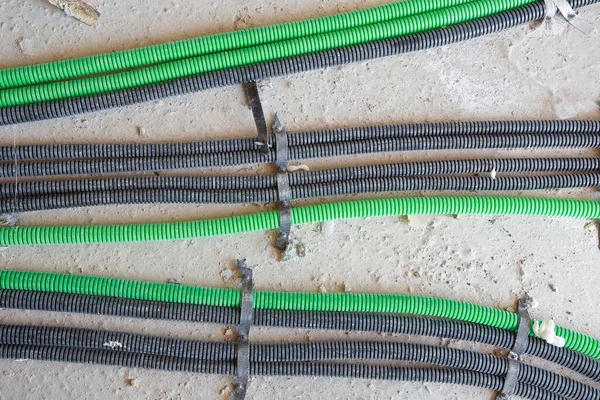 Corrugated colorer and flexible plastic pipe for electrical wiring and power cables in a construction site
