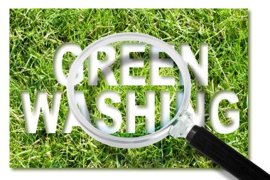 Alert to Greenwashing - concept with text against a forest and trees and magnifying glass