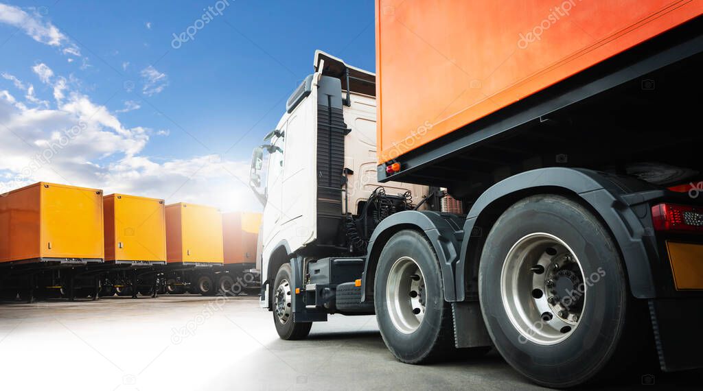Semi Trailer Truck Parking lot at a Blue. Cargo Shipping Container. Truck Wheels Tires. Industry Freight Truck Logistics Cargo Transport.