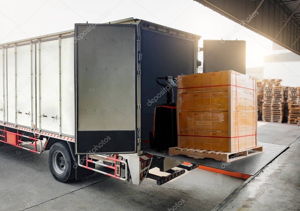 Cargo Truck Container Loading Packaging Boxes at Dock Warehouse. Slider Lift for Loading Truck. Shipment. Supply Chain Delivery. Warehouse Shipping. Lorry. Industry Freight Truck Transport Logistics.