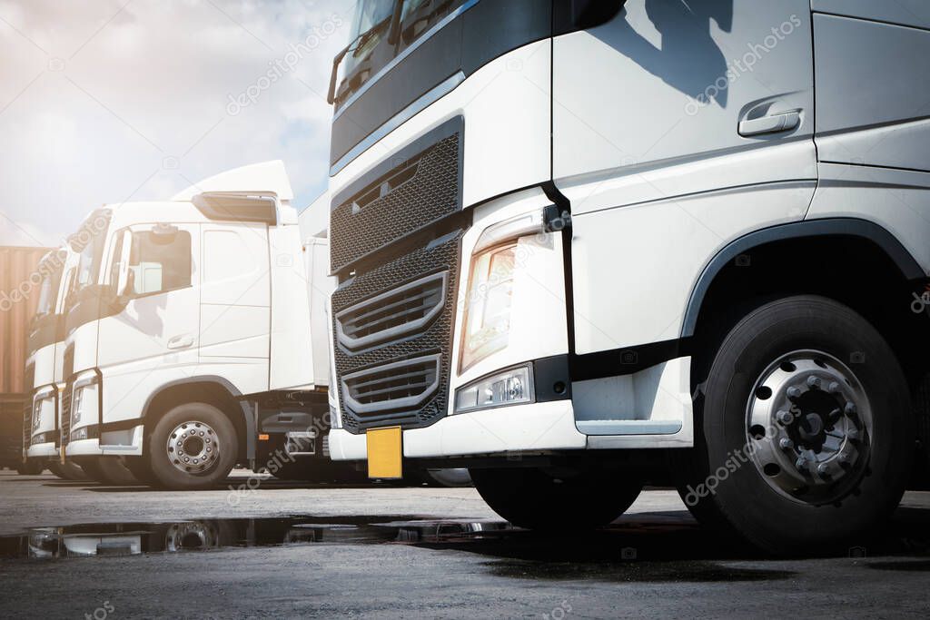 Semi Trucks the Parking Lot at The Warehouse. Industry Road Freight Truck. Logistic and Cargo Transport Concept.