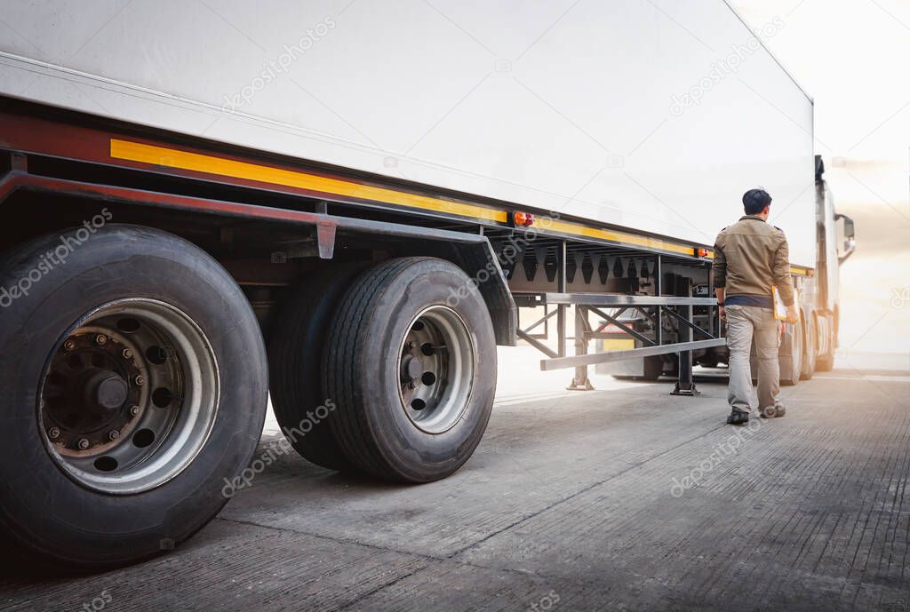 Semi Trailer Truck the Parking with Truck Driver. Industry Cargo Freight Truck Transport and Logistics. Checking the Truck's Safety Maintenance Inspection Truck Safety of Semi Truck Wheels Tires.