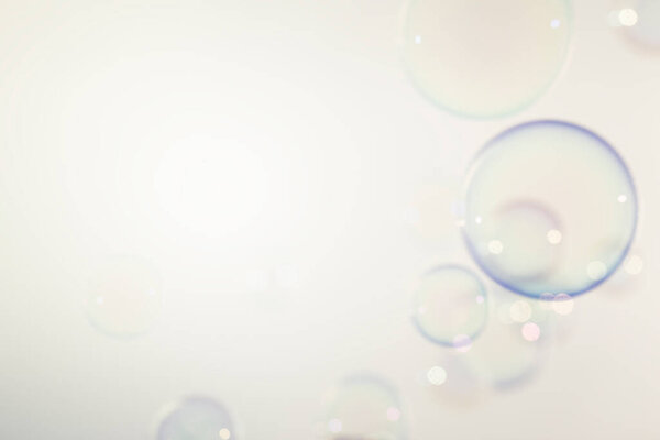 Blurred Transparent Soap Bubbles Background. Soap Suds Bubbles Water