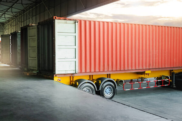 Cargo Container Trailer Parked Loading Dock at Distribution Warehouse. Shipping Trucks. Lorry. Cargo Freight Trucks Transport Logistics.