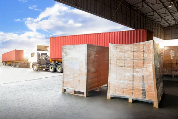 Packaging Boxes Wrapped Plastic on Pallets Loading into Cargo Container. Loading Dock Shipping Trucks. Supply Chain. Shipment Boxes. Distribution Warehouse Freight Truck Transport Logistics