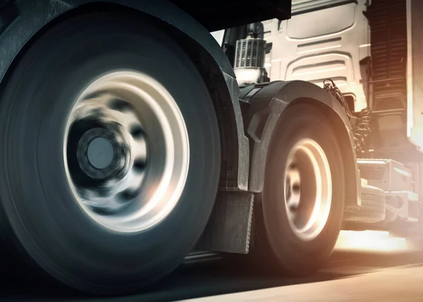 Spinning Truck Wheels. Semi Trucks Driving on the Road. Diesel Truck. Freight Truck Logistics Cargo Transport Concept.