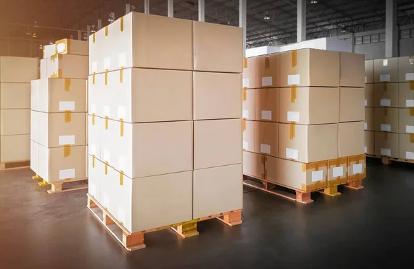 Packaging Boxes Stacked on Pallets in Storage Warehouse. Cartons Cardboard Boxes. Supply Chain. Storehouse Distribution. Shipping Supplies Warehouse Logistics.