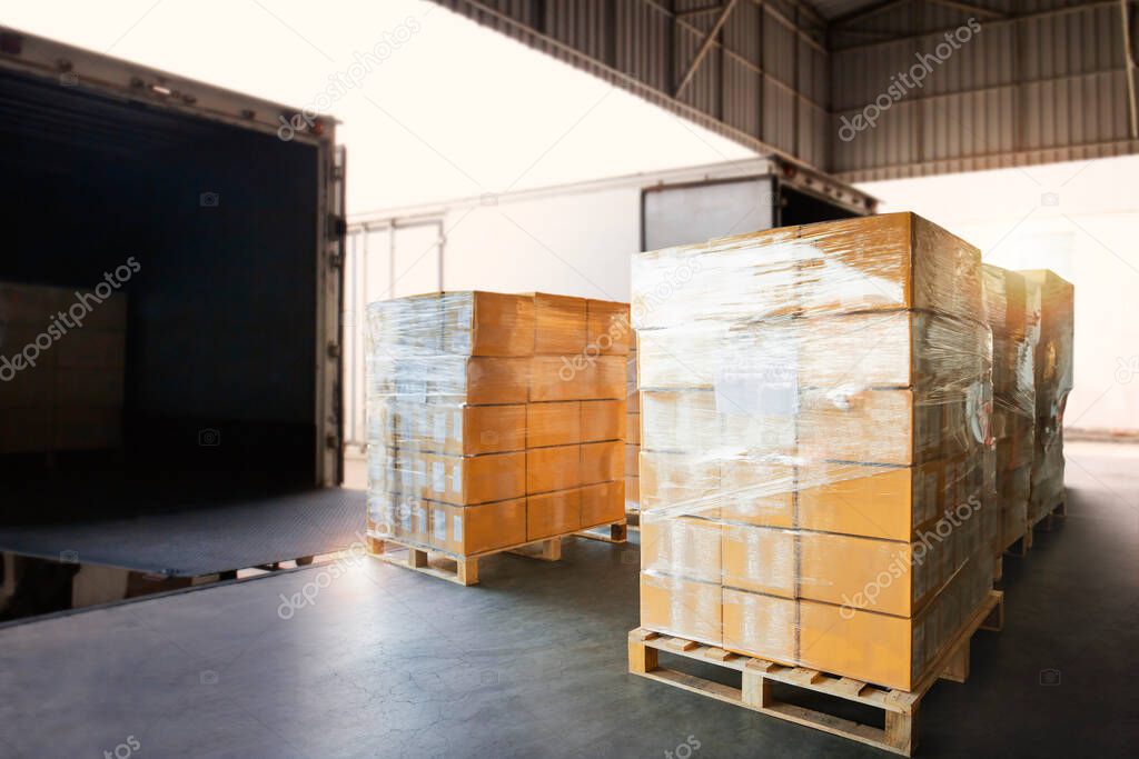 Packaging Boxes Wrapped Plastic on Pallets Loading into Cargo Container. Shipping Trucks. Supply Chain. Shipment Boxes. Distribution Warehouse Freight Truck Transport Logistics.