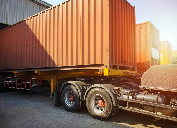 Cargo Container Trailer Parked Loading Dock at Distribution Warehouse. Shipping Trucks. Lorry. Cargo Freight Trucks Transport Logistics.