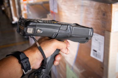 Workers Scanning Bar Code Scanner on Package Boxes. Shipping Warehouse. Cargo Shipment. Computer Mobile Work Tools for Inventory Management. Shipping Storehouse.
