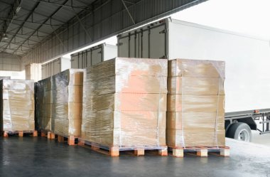 Packaging Boxes Wrapped Plastic Stacked on Pallets Loading into Cargo Container. Shipping Trucks. Supply Chain Shipment. Distribution Supplies Warehouse. Freight Truck Transport Logistics