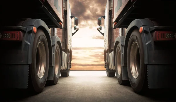 Semi TrailerTrucks on Parking with The Sunset Sky. Truck Wheels Tires. Shipping Container Truck. Delivery Transit. Engine Diesel Truck Tractor. Industry Freight Trucks Logistics Cargo Transport.