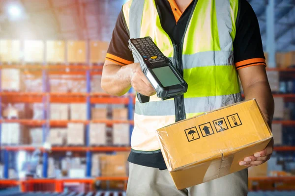 Workers Scanning Bar Code Scanner on Packaging Boxes. Shipping Storehouse. Storage Warehouse. Shipment Boxes. Computer Scanner Mobile Work Tools for Inventory Management.