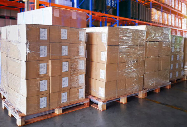 Packaging Boxes Wrapped Plastic Stacked on Pallets. Storage Warehouse. Cartons, Cardboard Boxes. Supply Chain. Storehouse Distribution. Cargo Shipping Warehouse Logistics.