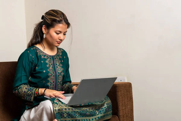 Happy Indian Girl Relaxing Comfortable Couch Working Laptop Home Surfing — Zdjęcie stockowe