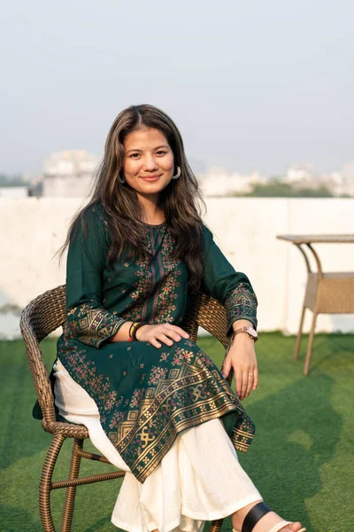 Young Indian Beautiful Girl Posing Camera While Sitting Chair Girl — Zdjęcie stockowe