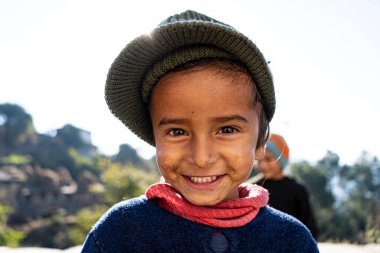 Almora, Uttarakhand - January 4 2022- A portrait of an indian kid who loves in the mountains. A kid portrait from Spiti, Ladakh and Uttarakhand.