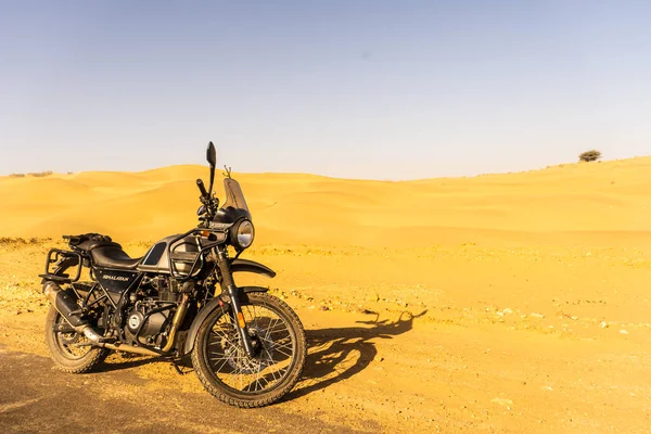 Jaisalmer, India - April 2 2020 - Adventure Bike Royal Enfield Himalayan on the roads of Jaisalmer in desert.