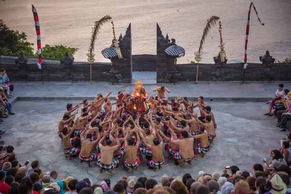 Bali - Indonesia - 10.21.2015: Kecak dancers performing the Fire Dance in the Pura Luhur Uluwatu amphitheater, Uluwatu Temple a Balinese Hindu sea temple on the hill