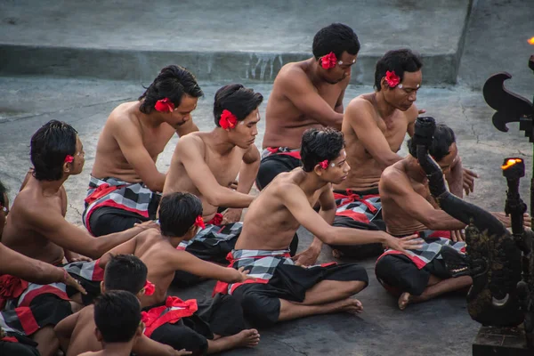 Bali - Indonesia - 10.21.2015: Kecak dancers performing the Fire Dance in the Pura Luhur Uluwatu amphitheater, Uluwatu Temple a Balinese Hindu sea temple on the hill