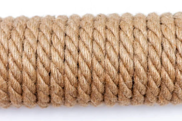 Close-up of sisal rope on white background. Top view, selective focus