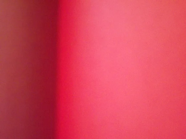 Bourgogne, karmozijn, rood, roze papieren oppervlak met een duidelijke scheiding van kleuren als achtergrond — Stockfoto