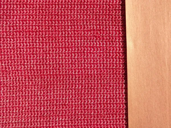 В'язана тканина рожевого, малинового кольору крупним планом як фон — стокове фото