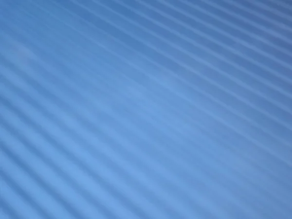 Superficie ondulada azul con rayas diagonales —  Fotos de Stock