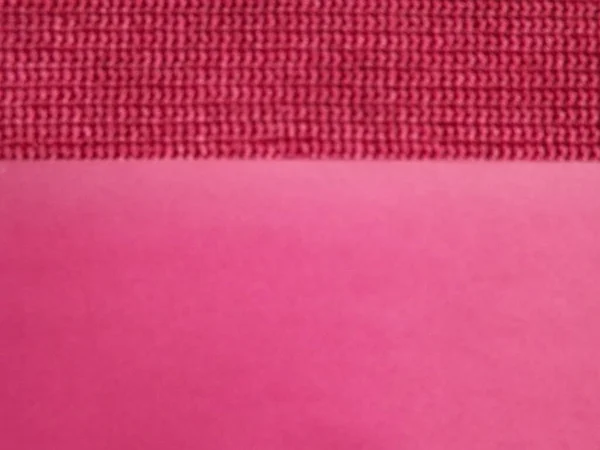 Tecido de malha de rosa, cor carmesim close-up como fundo — Fotografia de Stock