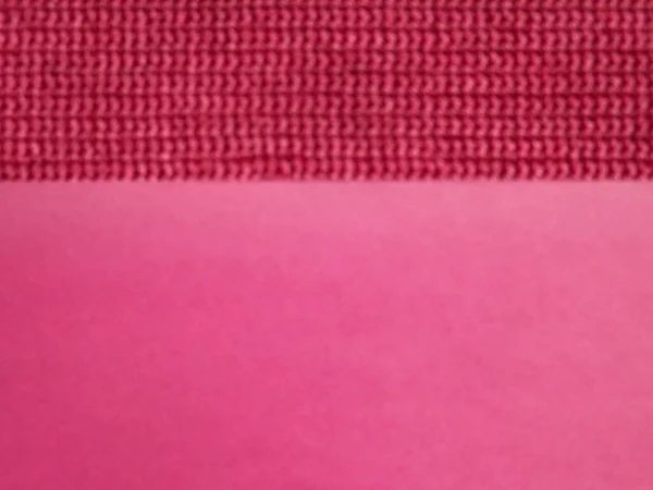 Knitted fabric of pink, crimson color close-up as a background — Stock Photo, Image