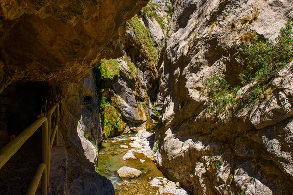 Cares river gorge route. Hiking trail in Picos de Europa National Park, Spain. Mountain path between impressive cliffs