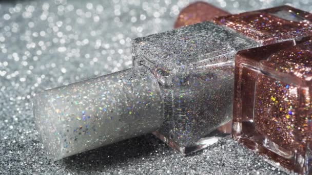 Nail polishes bottles close-up. Square bottles with nail varnish — Stock Video