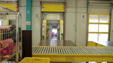 Packaging lines in a warehouse of a modern factory. A warehouse work department. High quality 4k footage