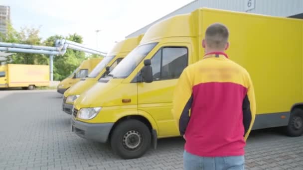 Uniformed Courier Goes Work Machine Yellow Start Handing Out Orders — Video