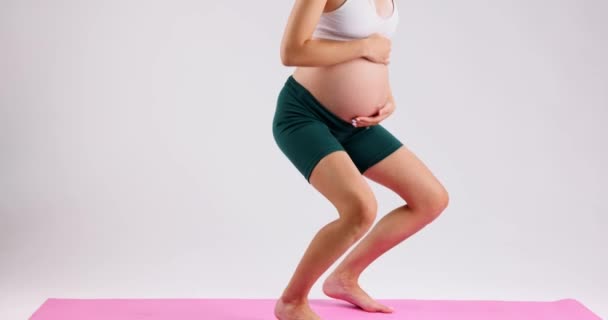 Young Pregnant Woman Does Squats Practicing Yoga Home Background White — Wideo stockowe