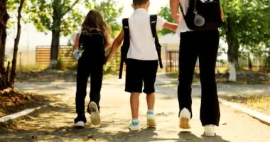 Friends Are Going to School. They Have A Lot of Fun Because Today is Their First Day at School. High quality 4k footage