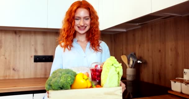 Young Lady Orange Hair Extends Beautiful Colorful Basket Vegetables Room — Stockvideo