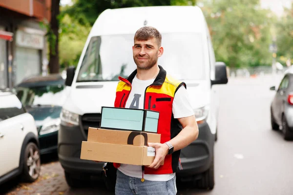 Image of delivery man holding parcel box. High quality photo