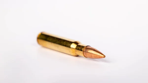 Rifle Bullet Lies White Surface — Zdjęcie stockowe