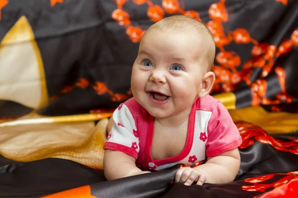 Funny baby on a dark background — Stock Photo, Image