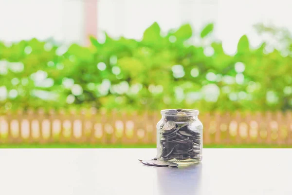 Stack of coins in a jar. Money saving concept.