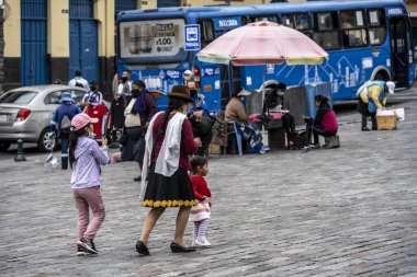 cityscape and local people from different angles of the mountainous capital of Ecuador, Quito 
