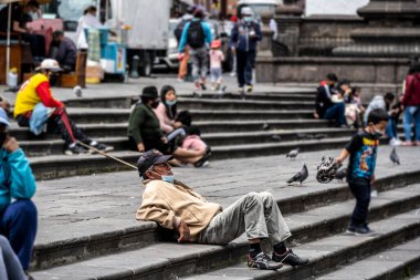 cityscape and local people from different angles of the mountainous capital of Ecuador, Quito 