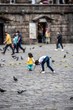 cityscape and local people from different angles of the mountainous capital of Ecuador, Quito 
